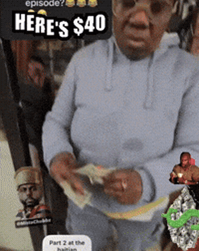 A Man Is Holding A Bunch Of Money And A Sign That Says Here 'S $ 40 On It GIF