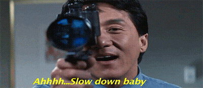A Man Is Holding A Camera In Front Of His Face And Saying Slow Down Baby . GIF