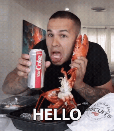 A Man Is Holding A Can Of Diet Coke And A Lobster GIF
