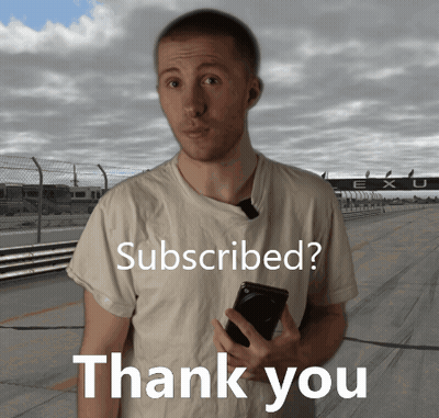 A Man Is Holding A Cell Phone In Front Of A Sign That Says " Subscribed " GIF