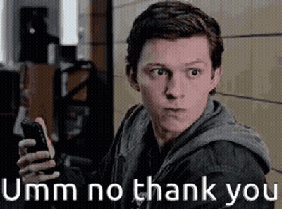 A Man Is Holding A Cell Phone In His Hand And Making A Face . GIF