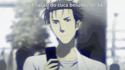 A Man Is Holding A Cell Phone In His Hand While Looking At It . GIF
