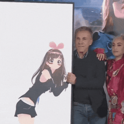 A Man Is Holding A Framed Picture Of A Girl With A Bow On Her Head GIF