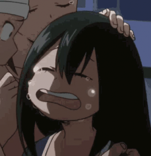 A Man Is Holding A Girl 'S Head Who Is Crying . GIF