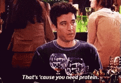 A Man Is Holding A Glass Of Wine And Saying That 'S Cause You Need Protein GIF