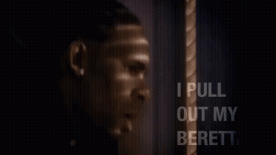 A Man Is Holding A Gun In His Hand And Says I Pull Out My Beretta . GIF