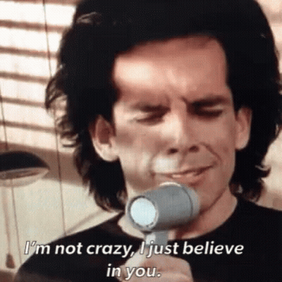 A Man Is Holding A Hair Dryer And Saying I 'M Not Crazy I Just Believe In You GIF