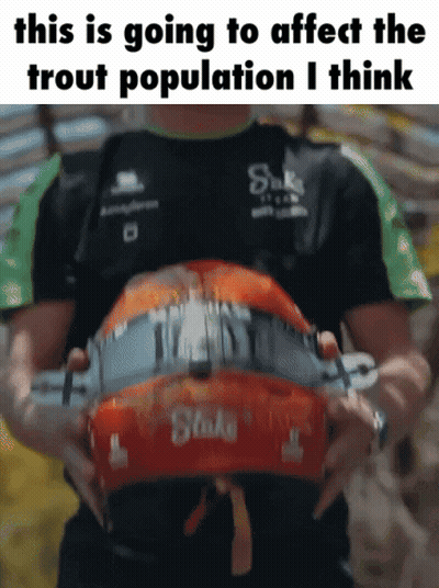 A Man Is Holding A Helmet With The Words This Is Going To Affect The Trout Population I Think On It GIF
