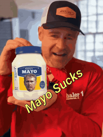 A Man Is Holding A Jar Of Mayo With A Picture Of George Bush On It GIF