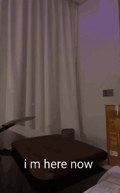 A Man Is Holding A Knife Over A Cutting Board And Says " Im Here Now " In The Corner GIF