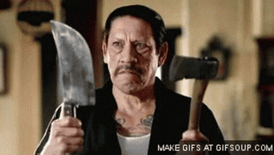 A Man Is Holding A Large Knife And A Hammer . GIF