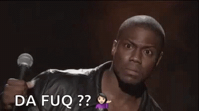 A Man Is Holding A Microphone And Making A Funny Face While Talking Into It . GIF