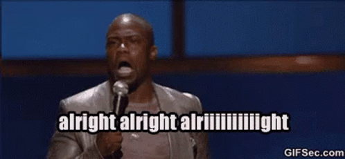A Man Is Holding A Microphone And Saying Alright Alright Alright GIF