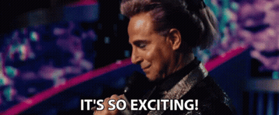 A Man Is Holding A Microphone And Saying It 'S So Exciting . GIF
