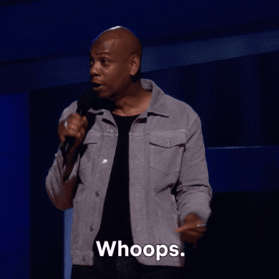 A Man Is Holding A Microphone And Saying " Whoops " GIF