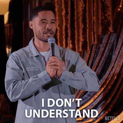 A Man Is Holding A Microphone And Says I Don T Understand GIF