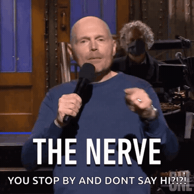 A Man Is Holding A Microphone And Says The Nerve GIF
