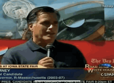 A Man Is Holding A Microphone In Front Of A Sign That Says " The Road To The White House " GIF