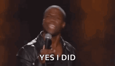 A Man Is Holding A Microphone In His Hand And Saying Yes I Did . GIF