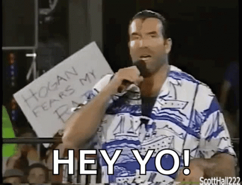 A Man Is Holding A Microphone While Holding A Sign That Says Hogan Fears My Baby . GIF