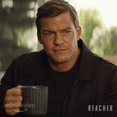 A Man Is Holding A Mug With The Word Prime Video On It GIF