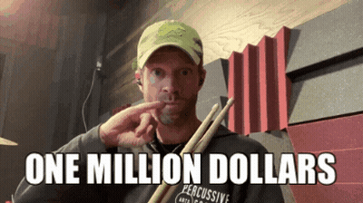 A Man Is Holding A Pair Of Drumsticks And Says " One Million Dollars " GIF