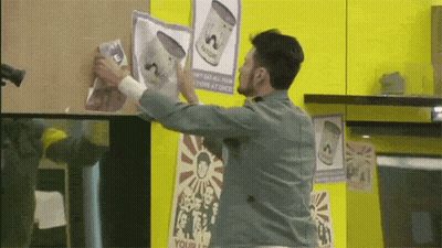 A Man Is Holding A Piece Of Paper That Says Your Life On It GIF
