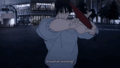 A Man Is Holding A Red Object In His Hand In Front Of A Building . GIF