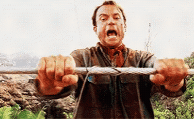 A Man Is Holding A Rope With His Mouth Open And Screaming . GIF