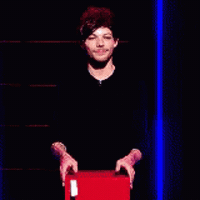 A Man Is Holding A Sign That Says Safe In Front Of Him . GIF