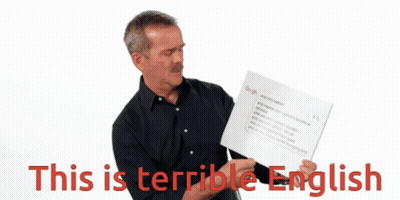 A Man Is Holding A Sign That Says This Is Terrible English GIF