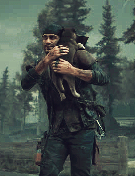 A Man Is Holding A Small Dog In His Arms . GIF