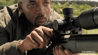 A Man Is Holding A Sniper Rifle With A #Geminiman Watermark GIF