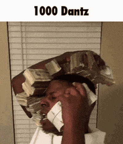 A Man Is Holding A Stack Of Money On His Head While Talking On A Cell Phone . GIF