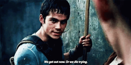 A Man Is Holding A Stick In His Hand And Talking To Another Man . GIF