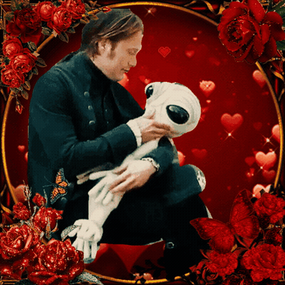 A Man Is Holding A Stuffed Animal Surrounded By Roses And Hearts GIF