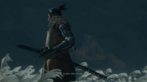 A Man Is Holding A Sword In A Field With A Full Moon In The Background GIF