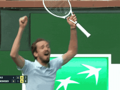 A Man Is Holding A Tennis Racquet In The Air In Front Of A Bnp Bank Logo GIF