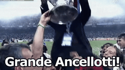 A Man Is Holding A Trophy In The Air With The Words Grande Ancellotti In The Corner GIF