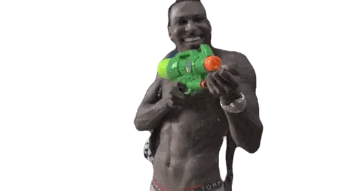 A Man Is Holding A Water Gun While Wearing A Stussy Bag Sticker