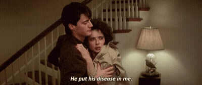 A Man Is Holding A Woman In His Arms And Says `` He Put His Disease In Me . '' GIF