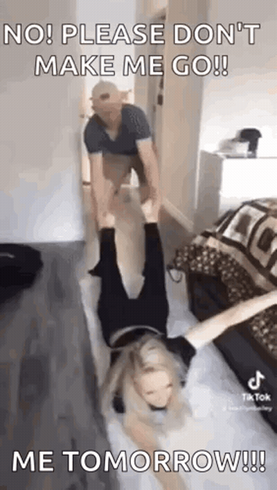 A Man Is Holding A Woman Upside Down On A Bed And Says `` No ! Please Don 'T Make Me Go ! '' GIF