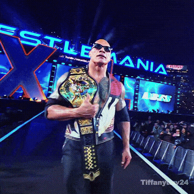A Man Is Holding A Wrestling Championship Belt In Front Of A Sign That Says ' Wrestling ' GIF