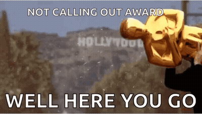 A Man Is Holding An Oscar Statue In Front Of Hollywood Sign GIF