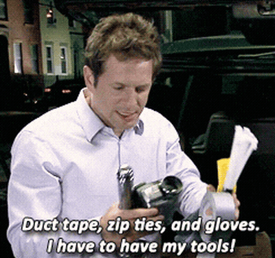 A Man Is Holding Duct Tape Zip Ties And Gloves And Says " I Have To Have My Tools " GIF