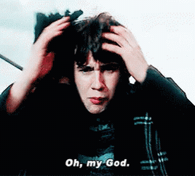 A Man Is Holding His Head While Saying Oh My God GIF