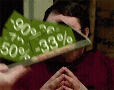 A Man Is Holding Up A Sign That Says 50 % -33 % GIF