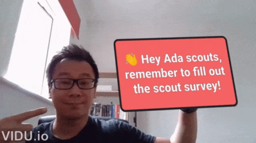 A Man Is Holding Up A Sign That Says Hey Ada Scouts Remember To Fill Out The Scout Survey GIF