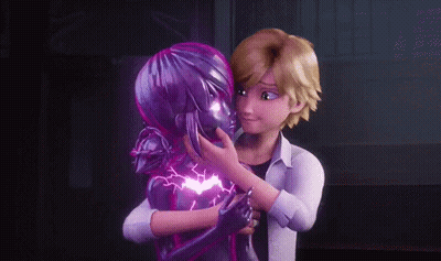 A Man Is Hugging A Purple Statue Of A Ladybug . GIF