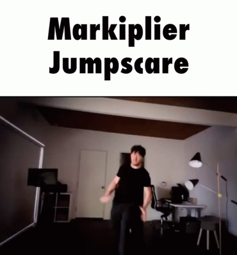 A Man Is Jumping In A Room With The Words Markiplier Jumpscare GIF